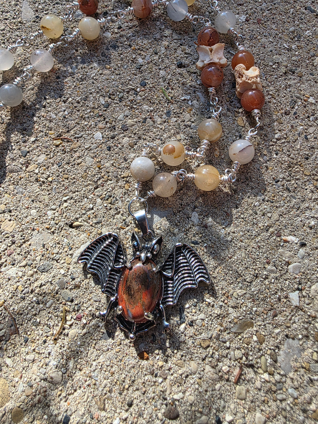 Bat and snake vertebrae necklace