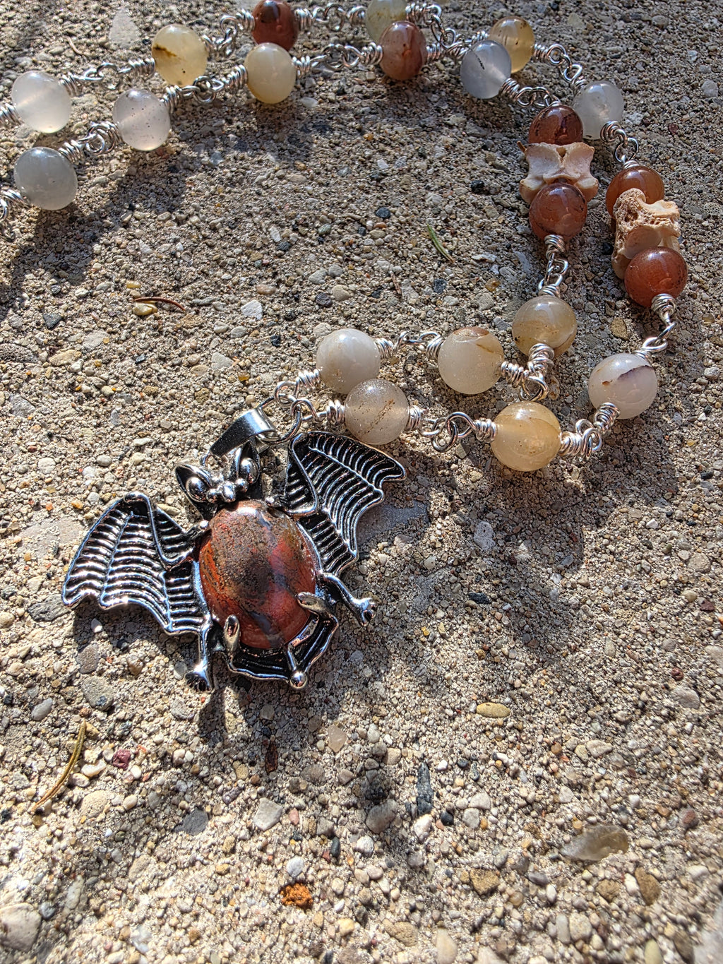 Bat and snake vertebrae necklace